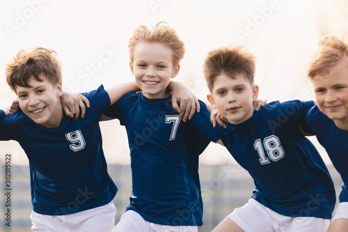 Happy Friends on a Soccer Team. Boys Sports Players Having Fun. Kids Soccer Players Cheering Together
