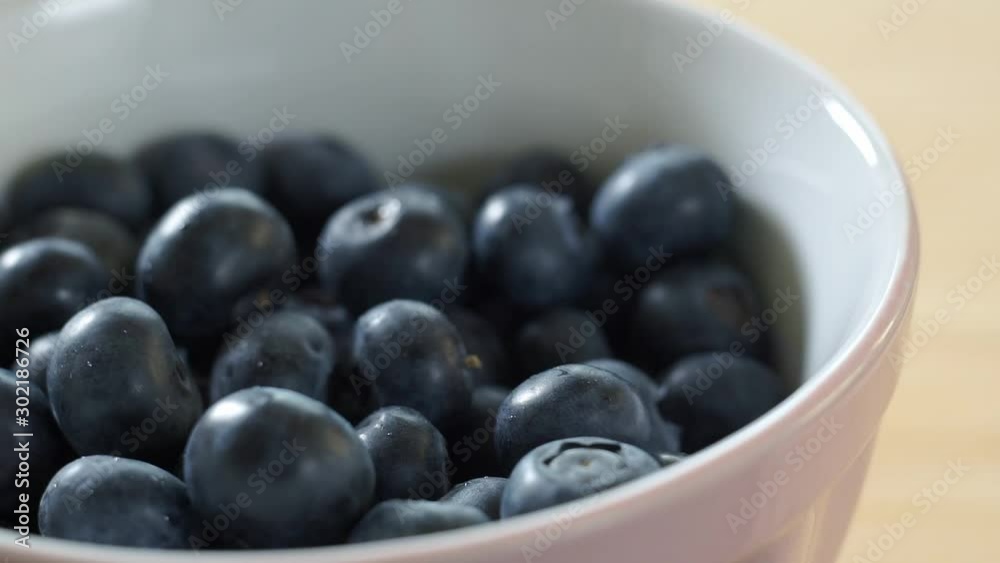 Blueberries fall on a plate. Sweet juicy berries. Healthy eating. Blueberries fall on a plate. Sweet juicy berries. Healthy eating.
