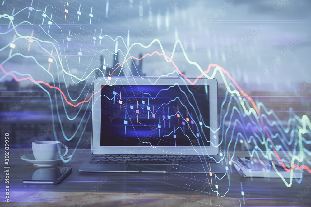 Forex Chart hologram on table with computer background. Multi exposure. Concept of financial markets.