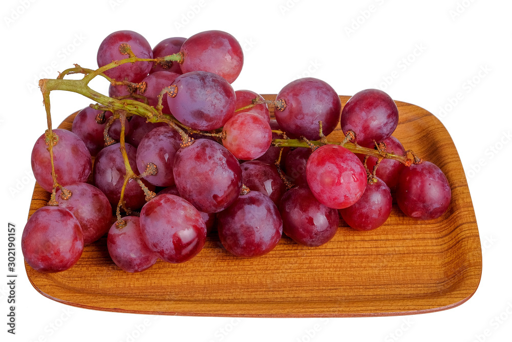 Fresh bunch of grapes on plate isolated on white background Fresh bunch of grapes on plate isolated on white background