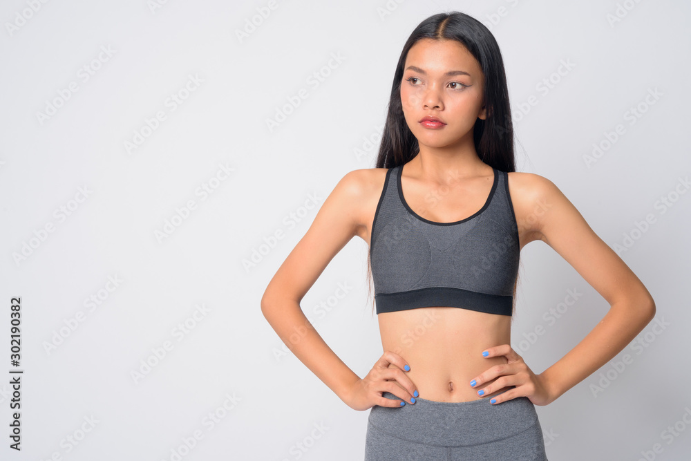 Portrait of young beautiful Asian woman thinking ready for gym Portrait of young beautiful Asian woman thinking ready for gym
