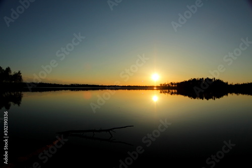 Sunset over the lake in the park. © Artem