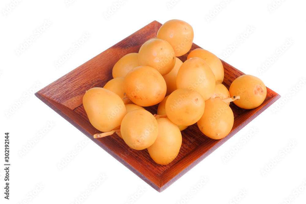 Yellow raw date palm isolated on white background. Yellow raw date palm isolated on white background.