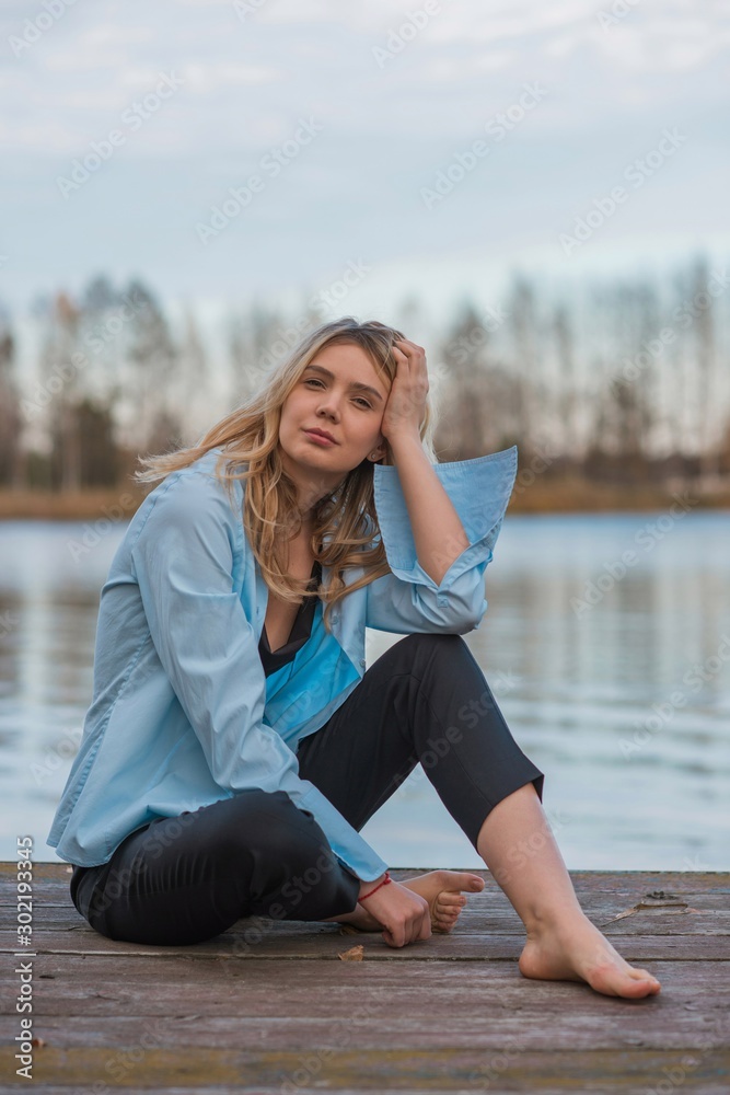 Young nice woman on a nature background. Concept of freedom and relax