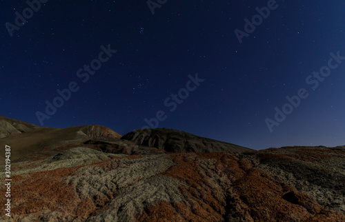 Red mountains on a moonlit night