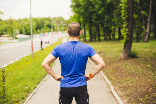 Back of man who preparing for hard run workout