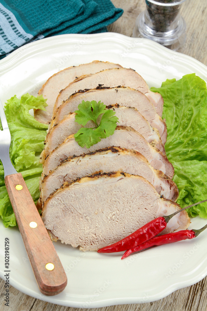 roast pork in the fillet on a plate roast pork in the fillet on a plate