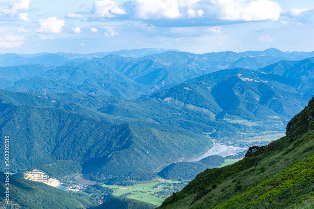 Fototapeta premium View from the summit of the beautiful mountains on a summer day.