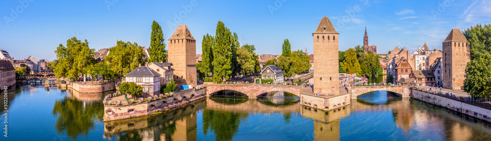 Panoramic view of the Ponts Couverts (covered bridges), a medieval set of bridges and defensive towers on the river Ill at the entrance of the Petite France historic quarter in Strasbourg, France.