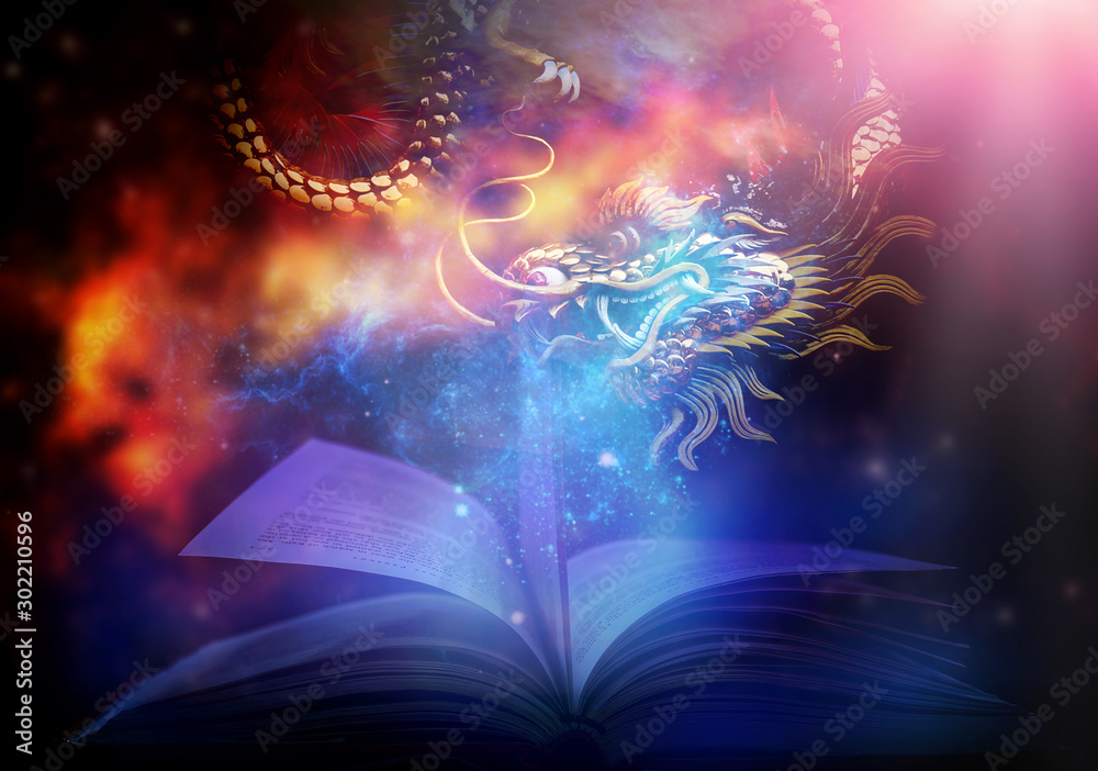 Fototapeta premium Magiczna książka ze światłem i blaskiem Niesamowita książka z opowieściami z gwiazdami i magicznymi smokami. I migoczące światła w tle
