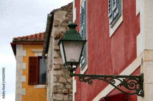 Retro lamp on a traditional colorful Mediterranean building in Stari Grad, on island Hvar, Croatia.