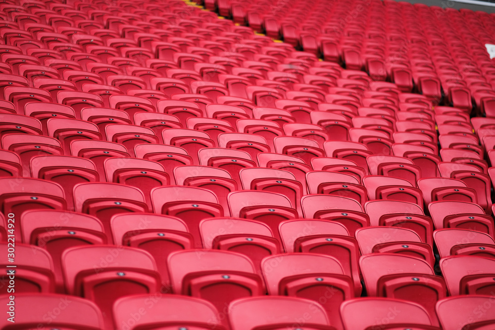 Fototapeta premium sport stadium chair. empty red concert chair. plastic red seats