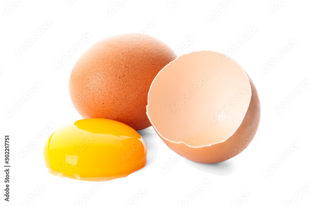 Chicken eggs and half yolk isolated on white background Chicken eggs and half yolk isolated on white background