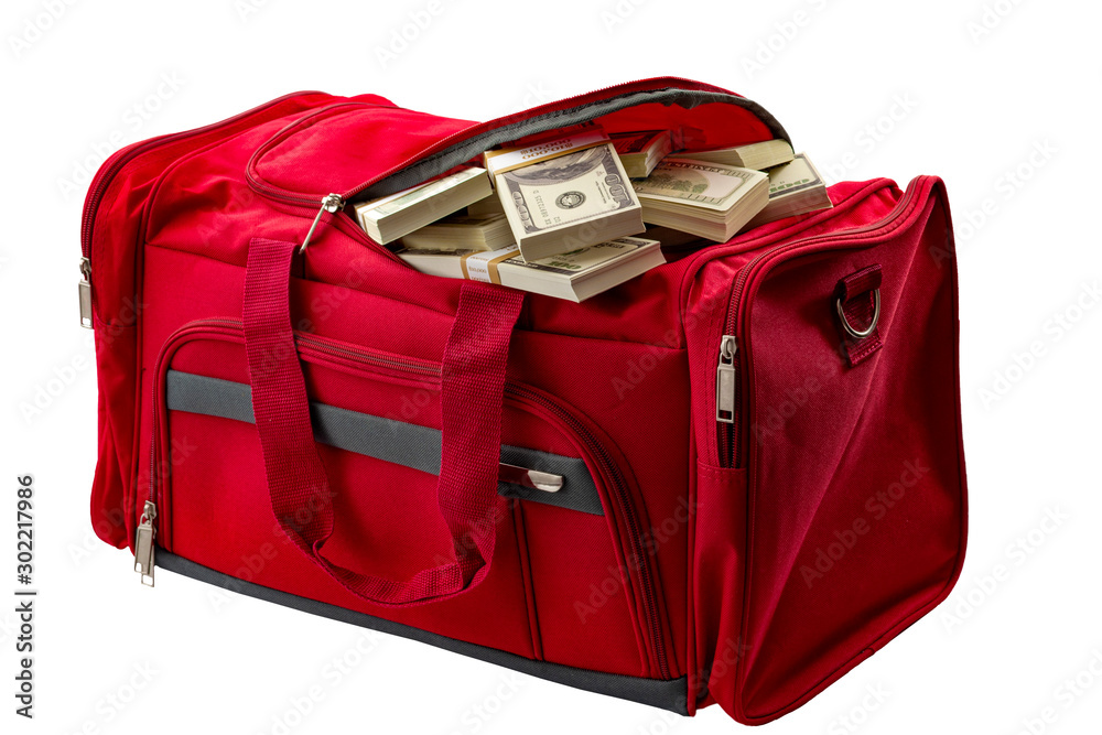 capitalism, money stash and loot in handbag conceptual idea with duffle bag  made of red material full of banknote heap isoalted on white background  with clipping path cutout Stock Photo