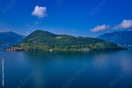 Coastline, Lake Iseo surrounded by mountains, Monte Isola island, Italy. Aerial view