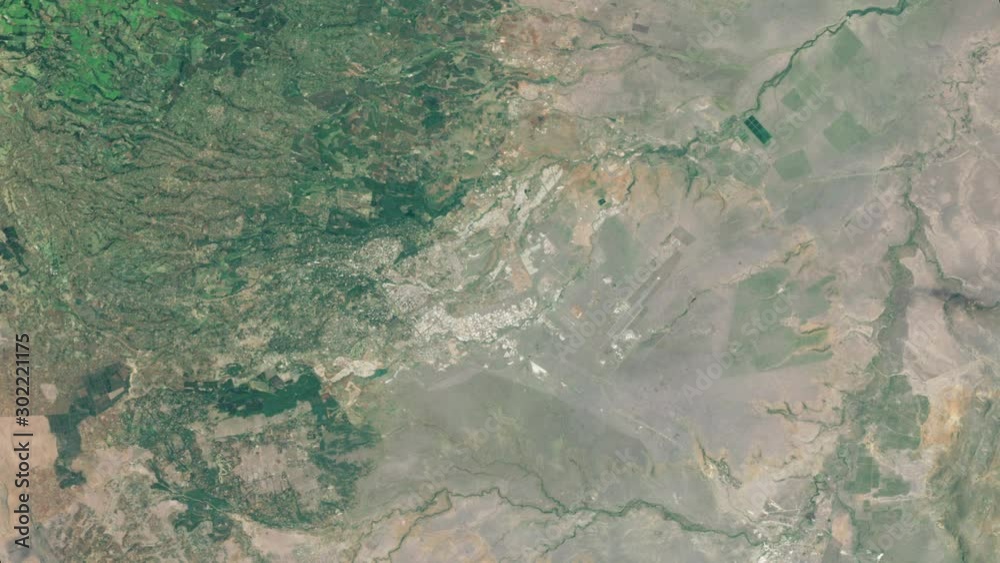 Aerial satellite view of Nairobi city in Kenya, rotating time lapse and visible urban growth in decades. Contains public domain image by Nasa