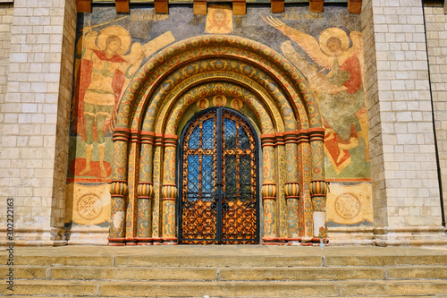 The gate at the entrance to the assumption Cathedral. Ancient door painted with Christian icons - Moscow, Russia, June 2019