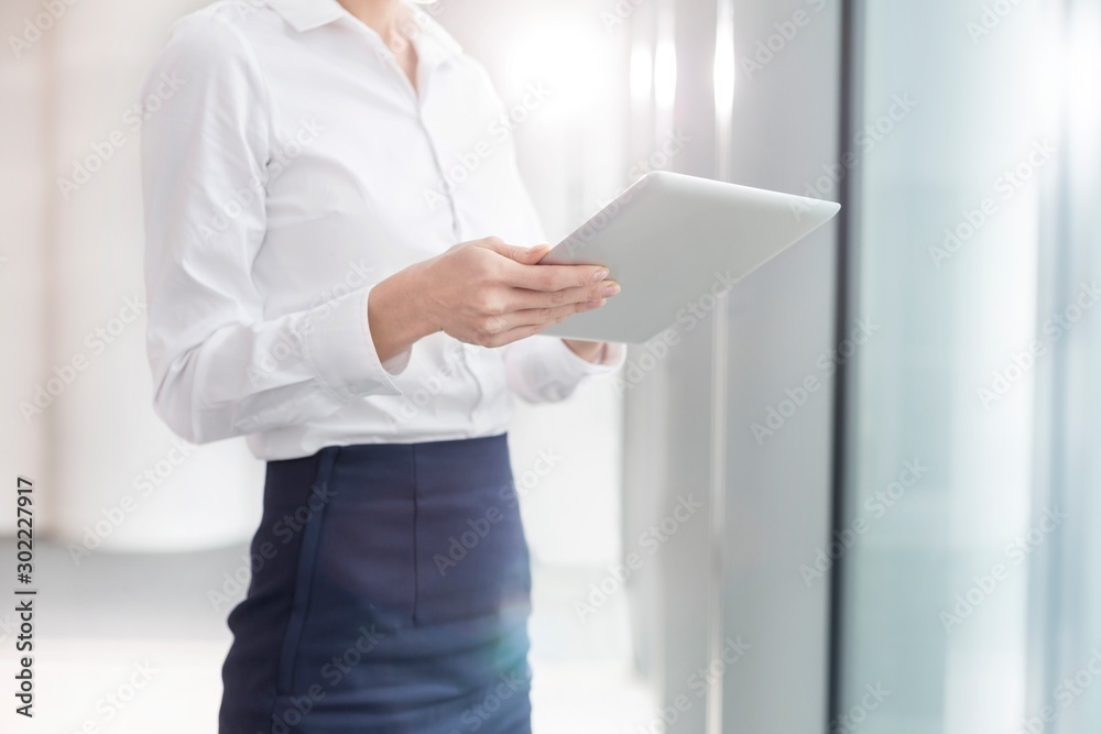Businesswoman using digital tablet in office