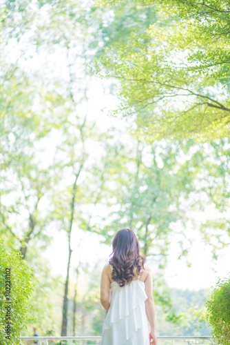 Beautiful asian womenwalking in city park sunshine day photo