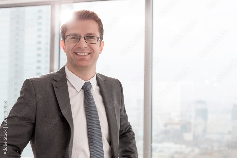 Businessman standing in office Businessman standing in office