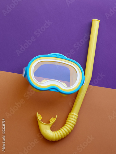  Mask for swimming on a colored background. Snorkeling concept. Concept of preparing to vocational rest. Concept of summer relaxing. Concept of diving and swimming..