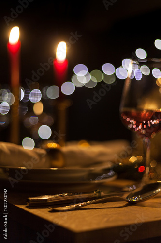 festive christmas table with candles and gold decoration cozy family meal