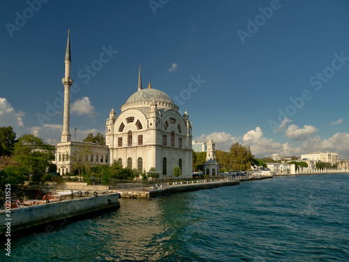 The beautiful Dolmabahce mosque on the banks of the Bosphorus strait with the Domabahche palace in the far right.