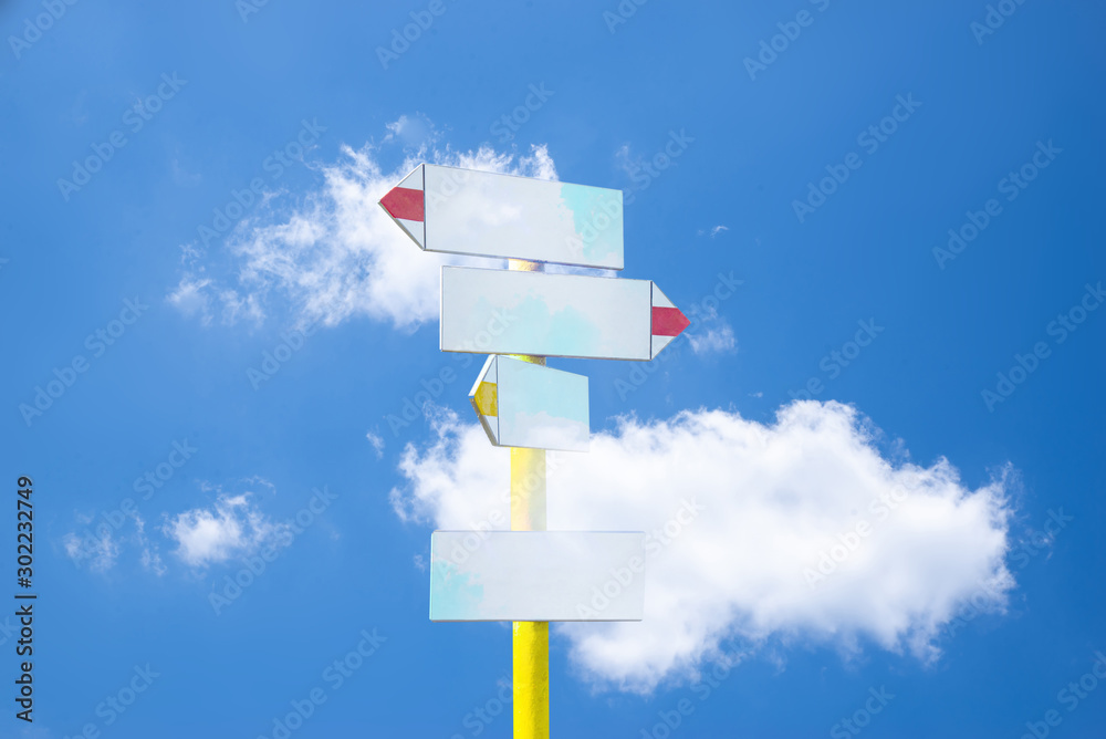 Blank signpost on a sunny day with beautiful blue sky and clouds. Blank signpost on a sunny day with beautiful blue sky and clouds.