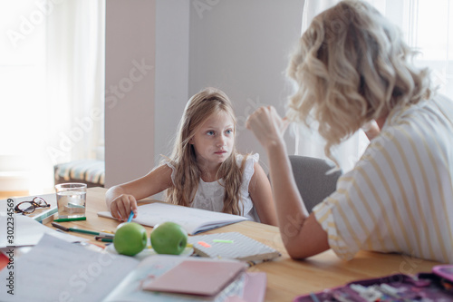 Mother and Daughter Studying at Home
