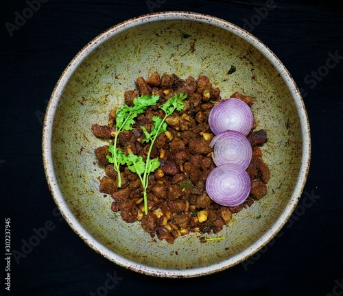South indian style beef fry with coconut and coriander leaf as a winter food