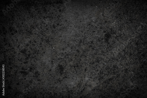 Black concrete wall texture background. Polished concrete floor grunge surface.