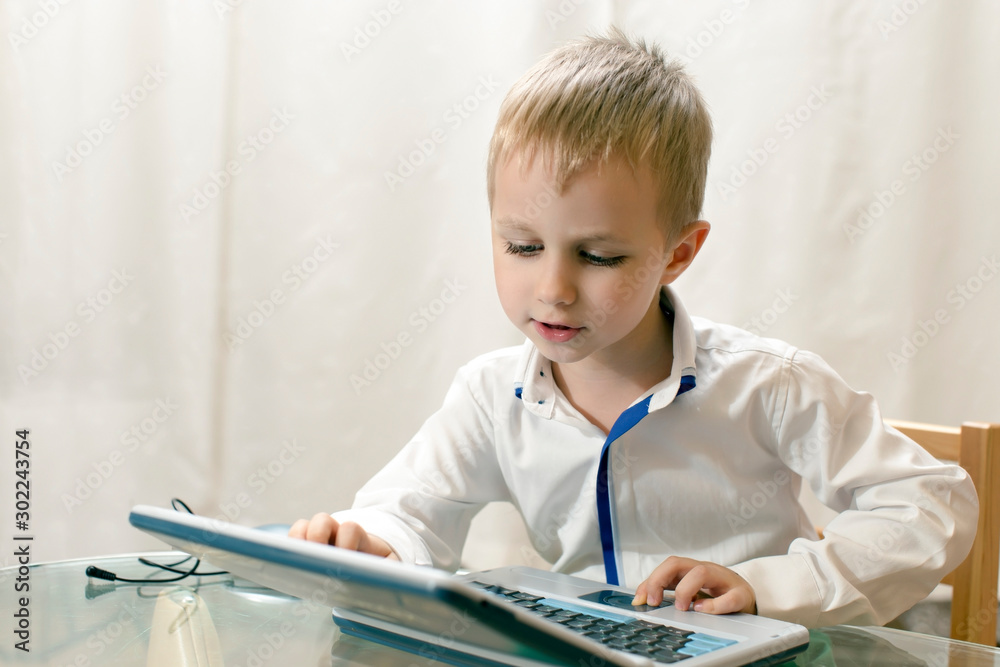 little boy plays on training computer little boy plays on training computer