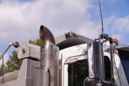 Close-up of a truck cab. Exhaust pipe visible.