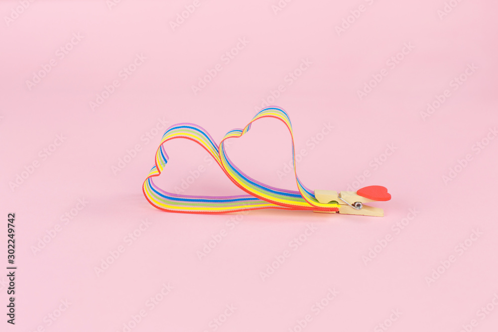 Rainbow ribbon awareness for LGBT community on pink background Rainbow ribbon awareness for LGBT community on pink background