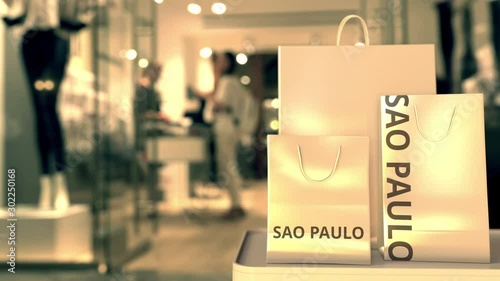 Wallpaper Mural Shopping bags with SAO PAULO text against blurred store. Brazilian shopping related clip Torontodigital.ca