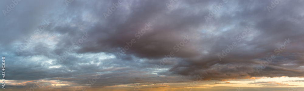 Fantastic dark thunderclouds, natural sky composition - wide panorama