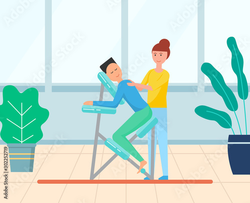 Masseuse stretching back of male client sitting in special armchair. Massage chair in massaging room with plants in flower pots, comfortable equipment