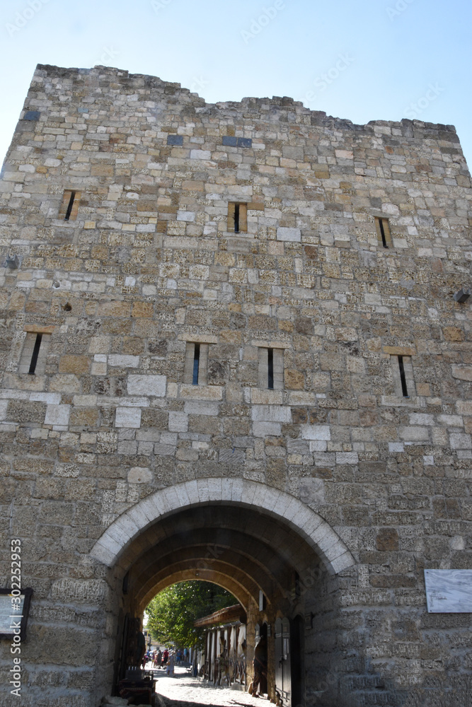 Evpatoria, Crimea September 2019 Odun Bazaar kapusy (Gate of the Wood Bazaar). A huge ancient wall of large bricks. Entrance to the market square.