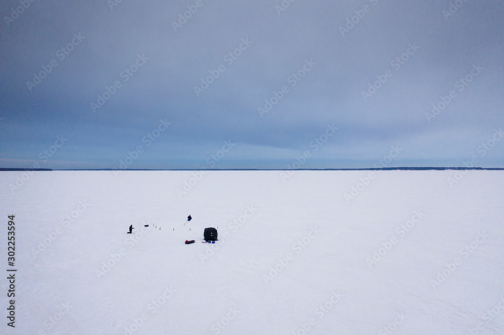 winter fishing on frozen lake winter fishing on frozen lake