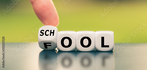 Don't be a fool and go to school. Hand turns a dice and changes the word "fool" to "school".