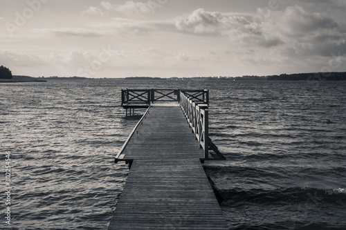 Fototapeta Naklejka Na Ścianę i Meble -  Wooden pier on the Swiecajty lake in Ogonki near Wegorzewo, Masuria, Poland