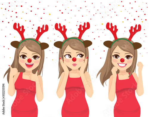 Happy dancing woman with deer headband and red nose celebrating Christmas