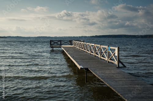 Fototapeta Naklejka Na Ścianę i Meble -  Wooden pier on the Swiecajty lake in Ogonki near Wegorzewo, Masuria, Poland
