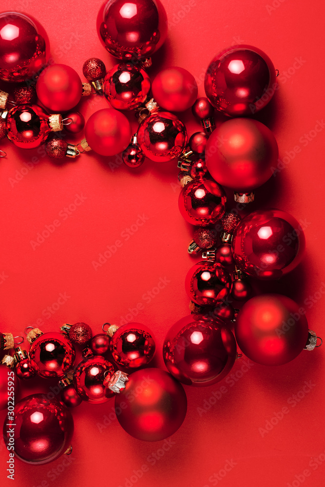 Christmas composition. Christmas red decorations on red background. Flat lay. Christmas and happy new year concept for Christmas promotion banner Christmas composition. Christmas red decorations on red background. Flat lay. Christmas and happy new year concept for Christmas promotion banner