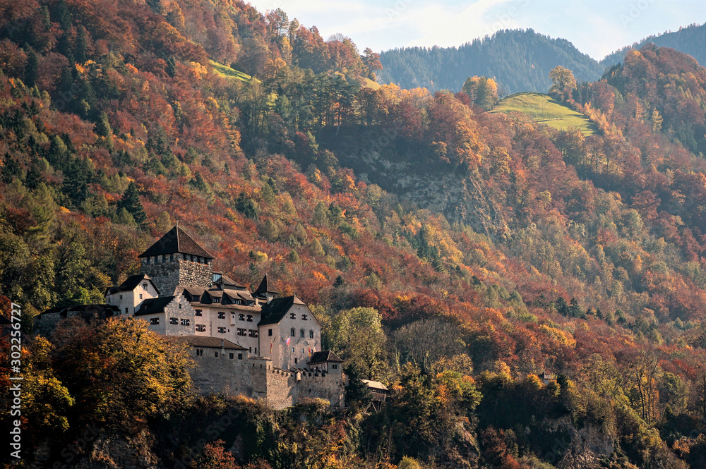 Vaduz, Lichtenstein. Schloss Vaduz with colorful forest in background.