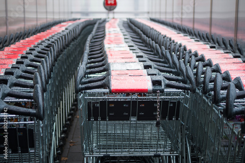 View of shopping carts parked outside a supermarket