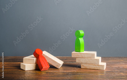 The green man crushed his opponent in a dispute. Winner in confrontation, diplomatic success, political games. Persistence Strength. Excellence and advantage, leadership skills and strategic thinking.