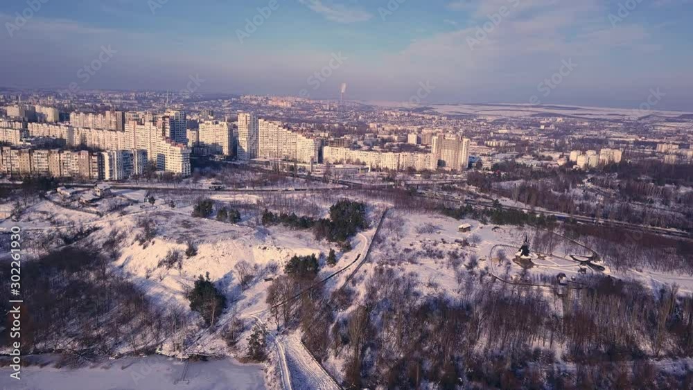 Top view of city in winter at sunset on sky background. Aerial drone videography concept. 4K. Kishinev, Republic of Moldova. Top view of city in winter at sunset on sky background. Aerial drone videography concept. 4K. Kishinev, Republic of Moldova.