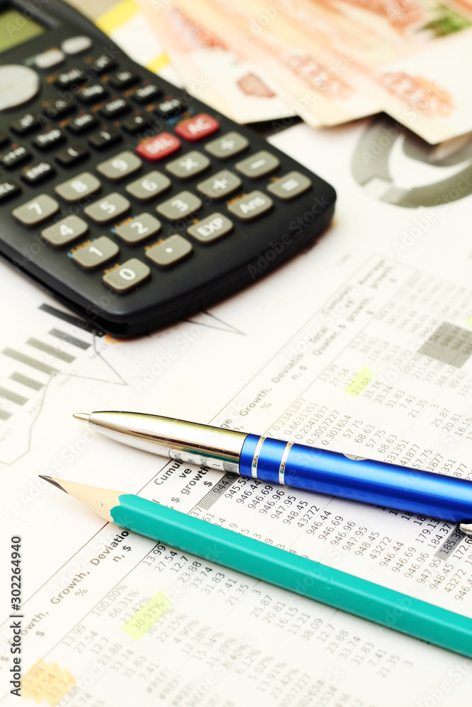 Business concept with a report and a calculator Business concept with a report and a calculator