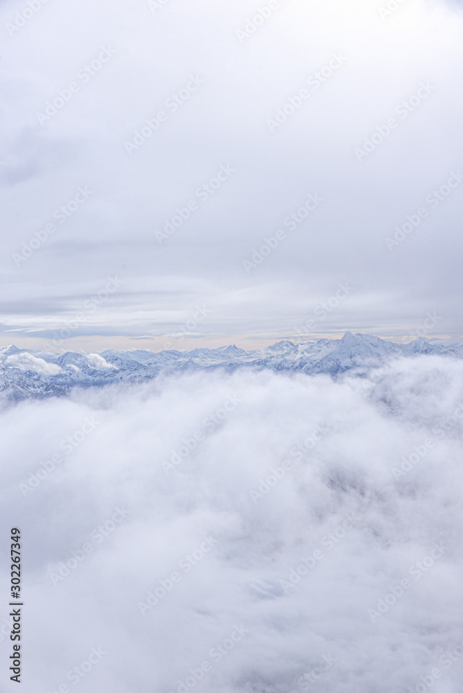 Mont Blanc. Aerial view of the Alps surrounded by clouds.